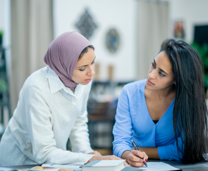 two professional women at work wearing headscarf
