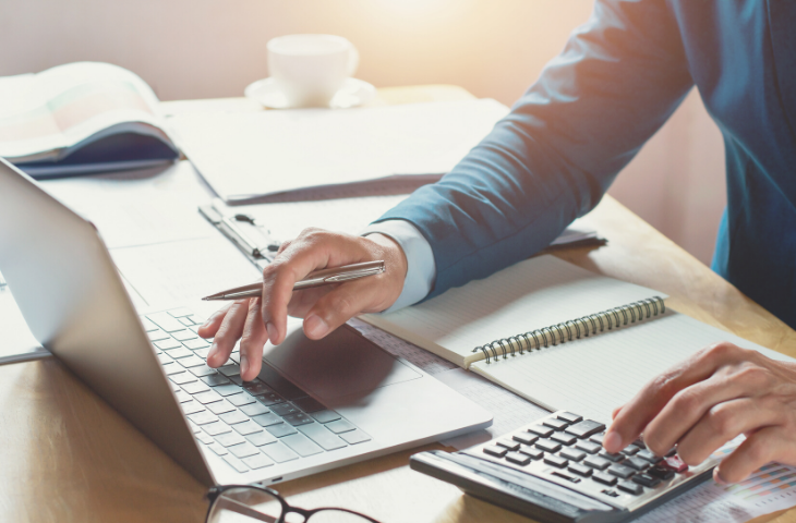 man doing taxes and taking advantage of changes to instant asset write off