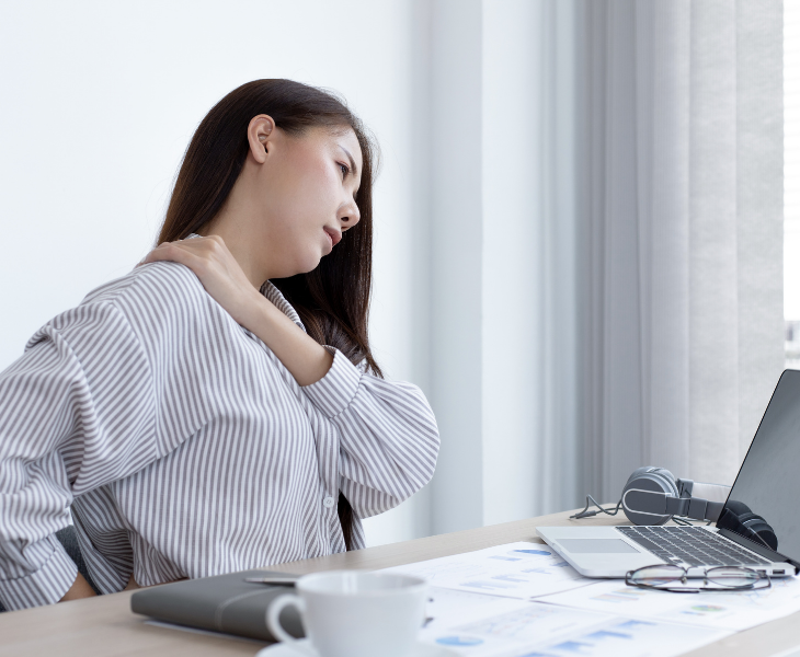 woman stretching at work office ergonomics