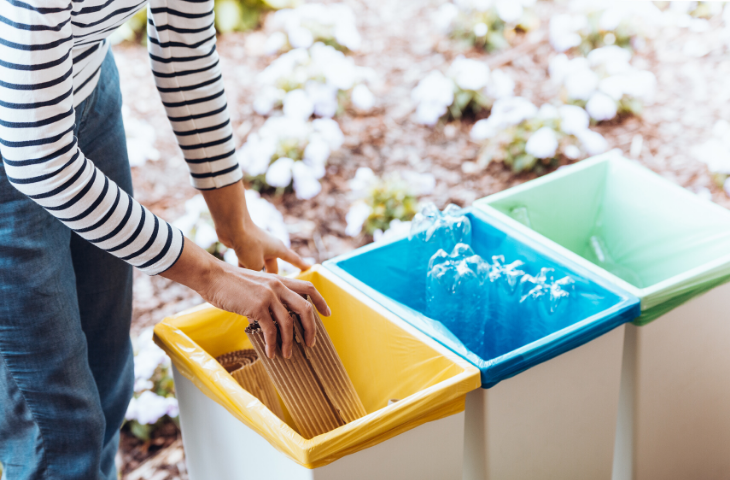 Woman remaining environmentally friendly during COVID-19 and recycling