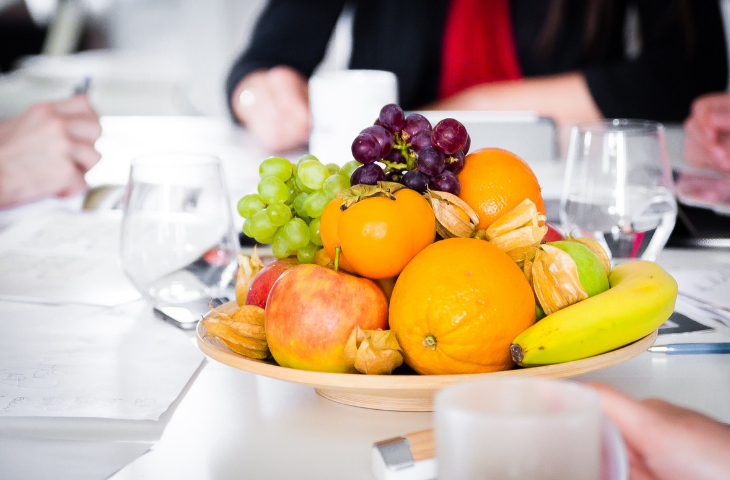 Plate of fresh fruit on a boardroom table