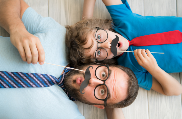 Man and boy celebrating movember at work