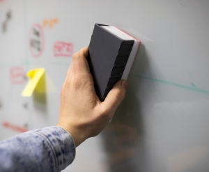 Rubbing a permanent markers mark from whiteboard.