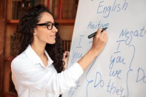 A woman using a whiteboard