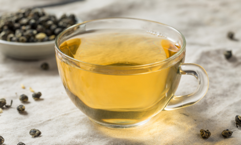 Organic hot Oolong tea on a saucer