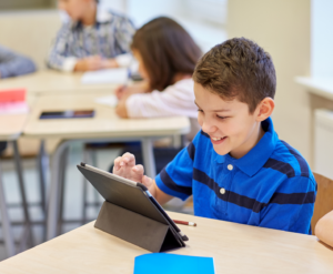 School Kids with Tablet in Classroom