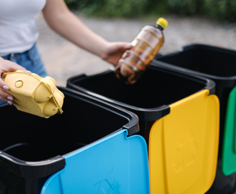 Woman confused about throwing garbage in Recycling Bins