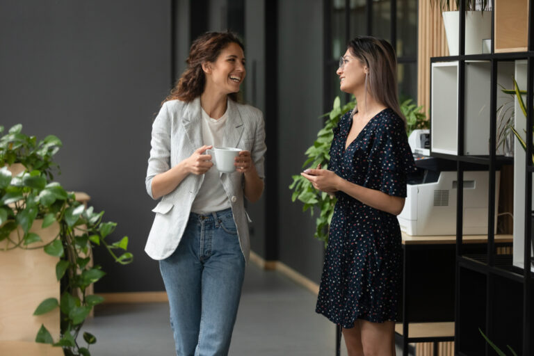 Asian,And,Caucasian,Ethnicity,Women,Colleagues,Met,In,Office,Hall