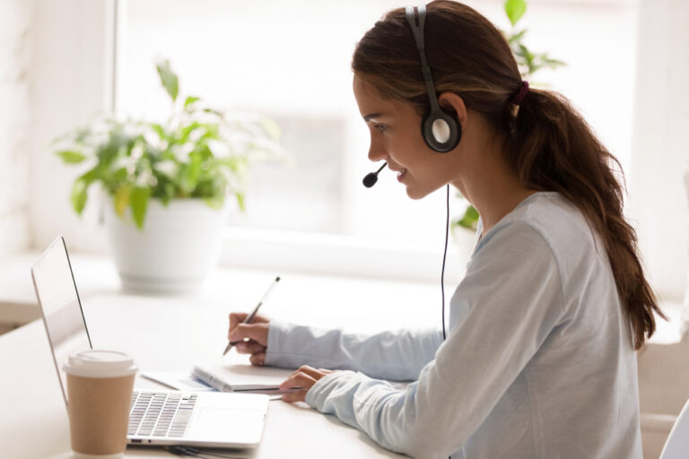 Side,View,Concentrated,Millennial,Multiracial,Woman,Wearing,Headset,With,Microphone