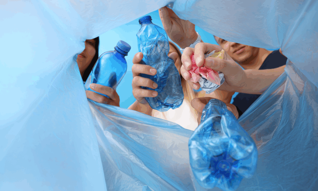 People with garbage in hands and garbage bag on blue background