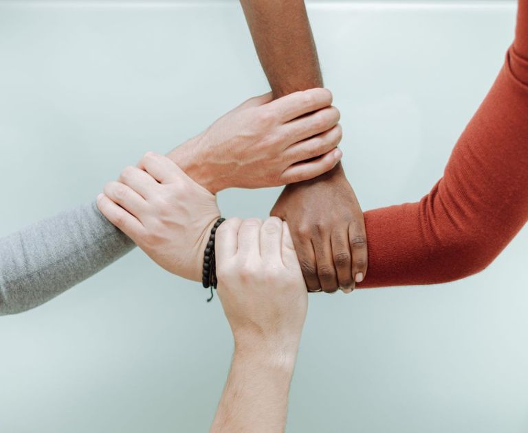 hand in hand to create an inclusive environment